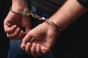 Handcuffed man - California child abuse laws