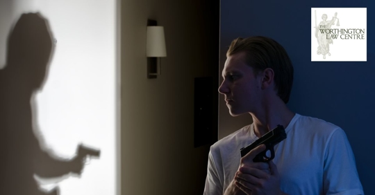 armed homeowner waiting for an armed burglar